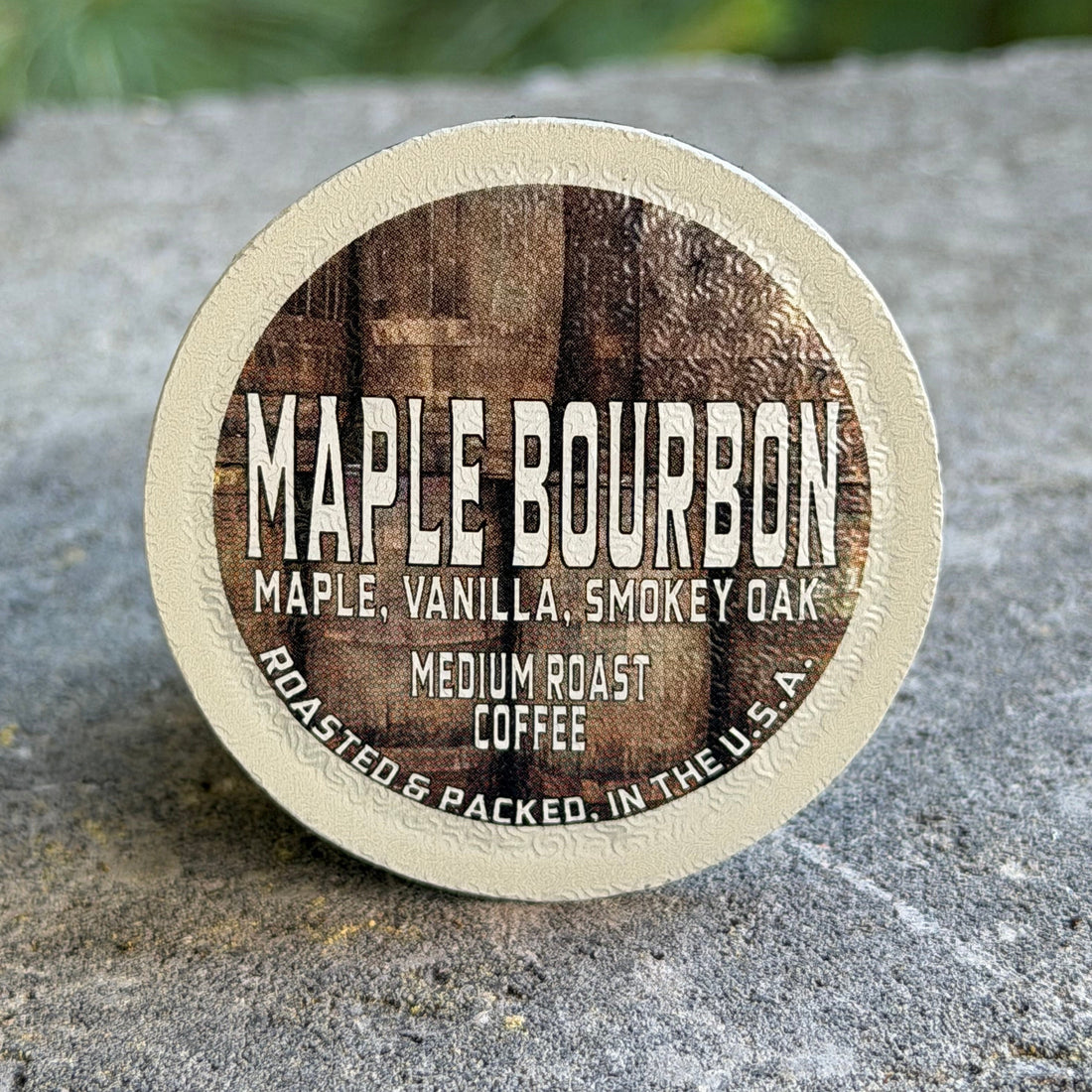 Hot cup of Coffee Maple Bourbon showing rich maple vanilla smoky oak flavored coffee in a white ceramic mug
