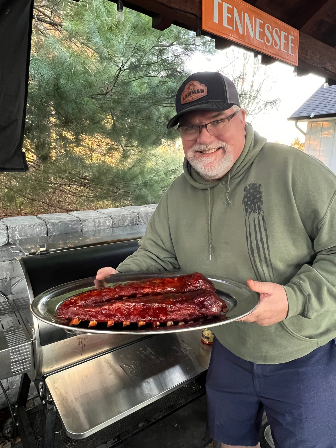 Best BBQ rub for ribs seasoning applied to pork ribs on smoker with bark forming