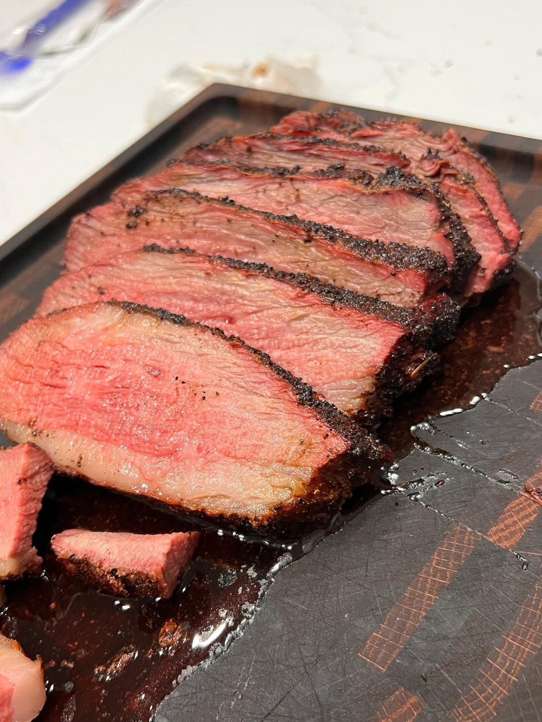 Cooked tri-tip with perfect crust from Tombstone Steak and Wild Game Seasoning on grill