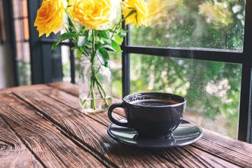 Spring morning coffee by the window featuring All American dark roast clean coffee, smooth low acid blend perfect for a fresh seasonal start